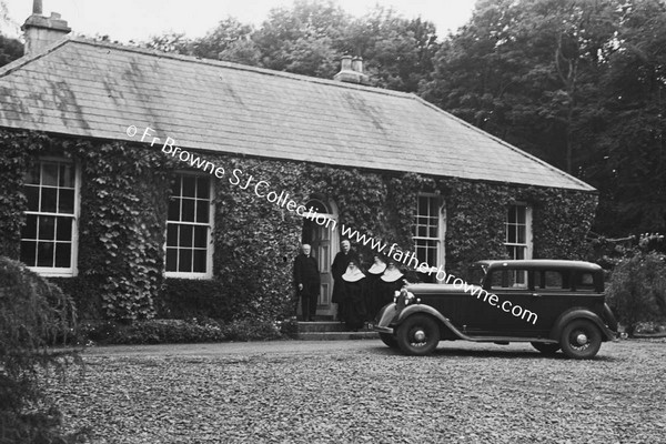 MERCY CONVENT WITH NUNS AT DOOR AND CAR